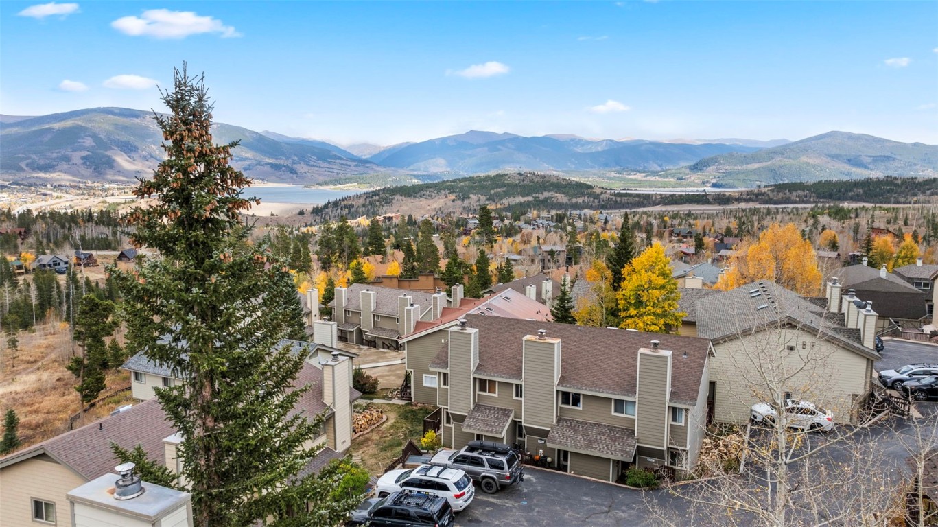 Aerial view with a mountain view.  Subject property is the middle unit.