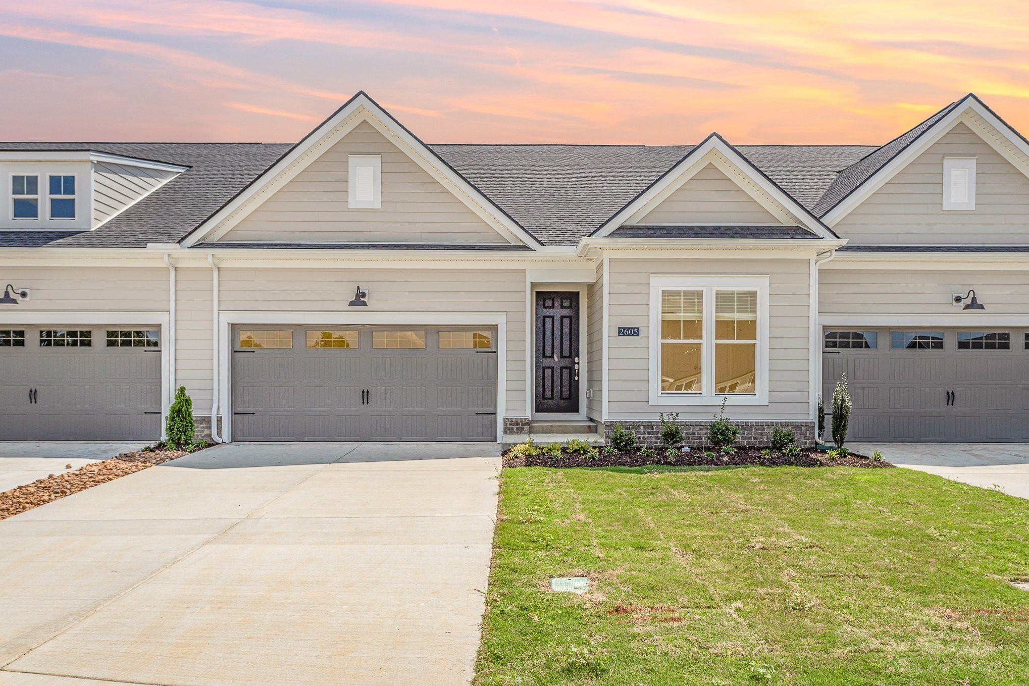 a front view of a house with a yard