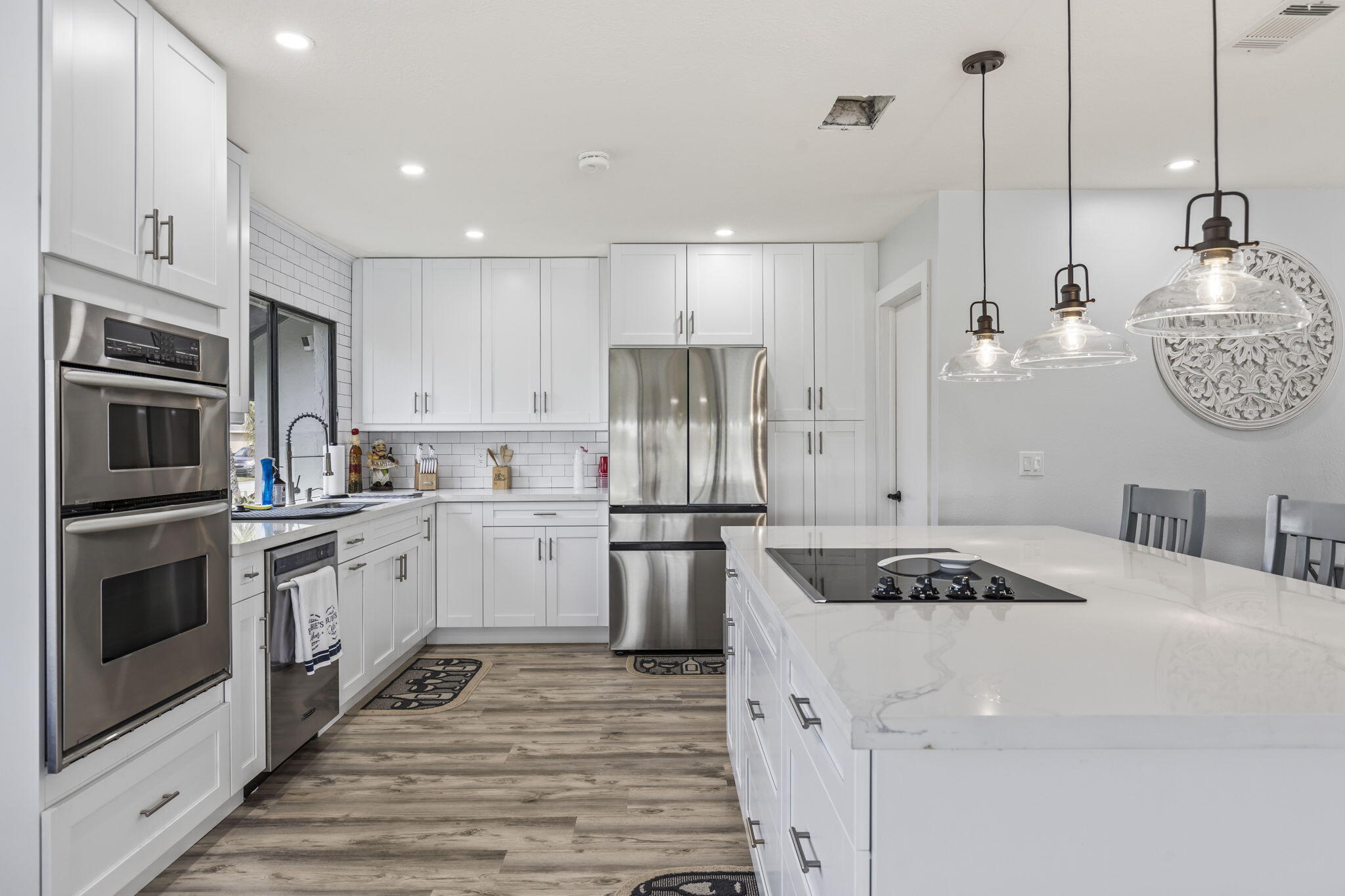 a kitchen with a sink stainless steel appliances and cabinets