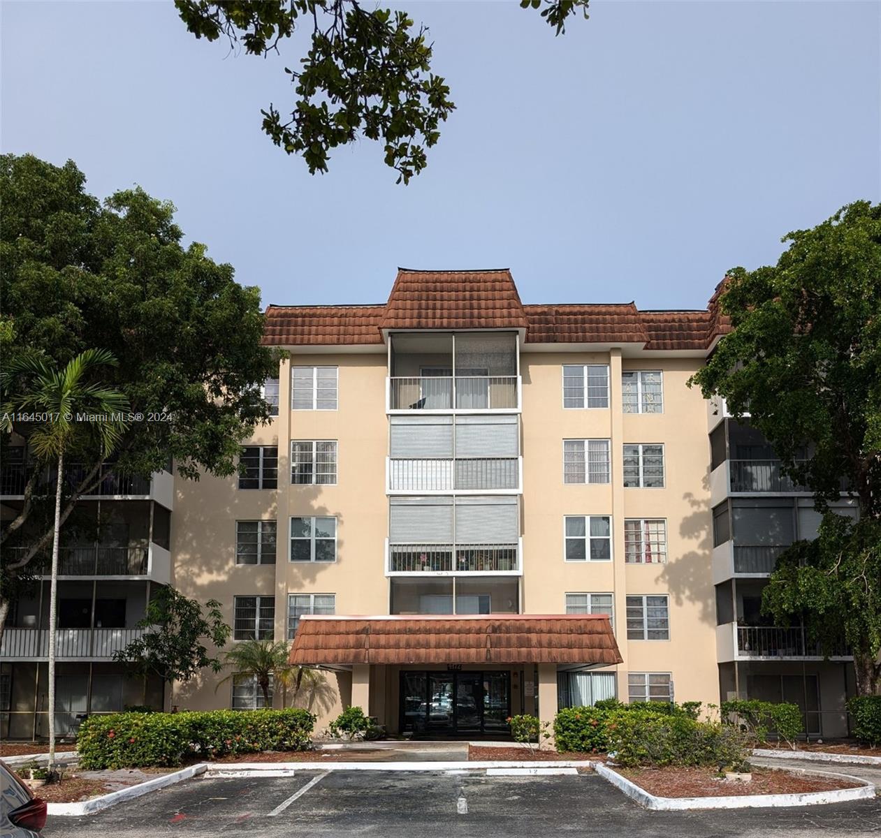 a front view of a building with street view