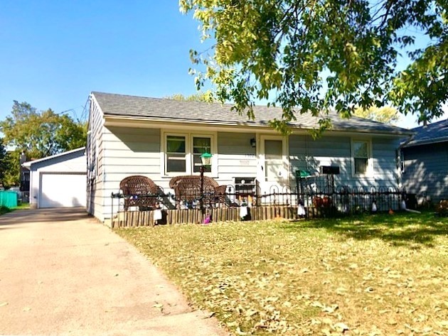 a view of a outdoor space with furniture and garden