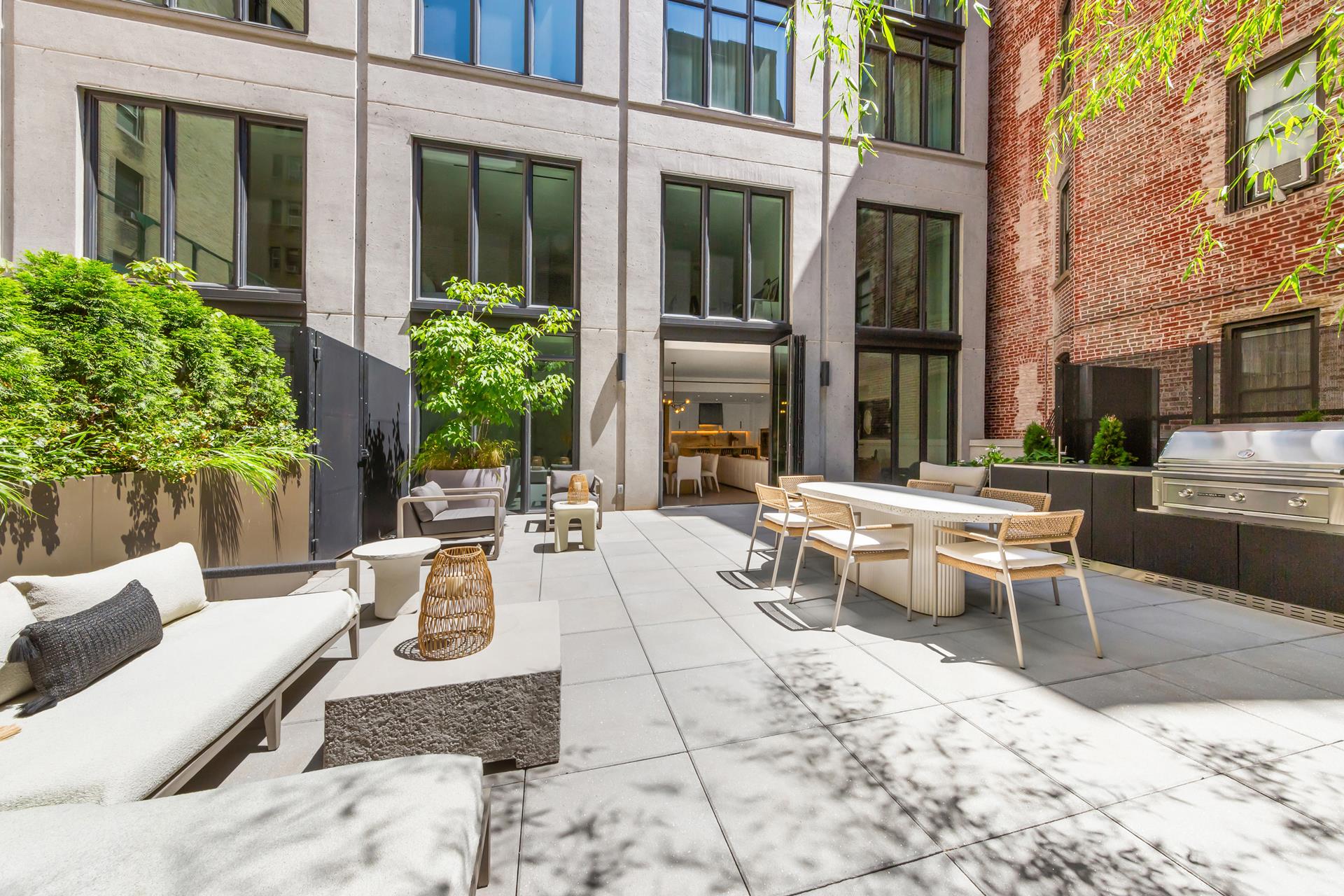 a view of a patio with a table and chairs in patio