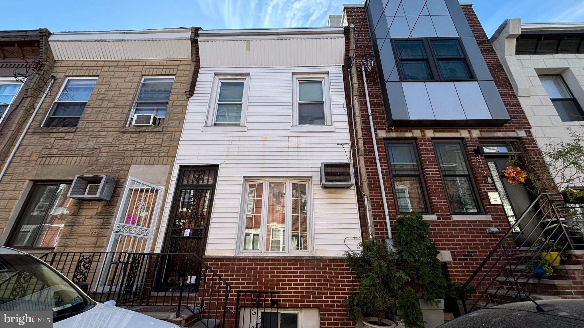 a front view of a house with glass windows