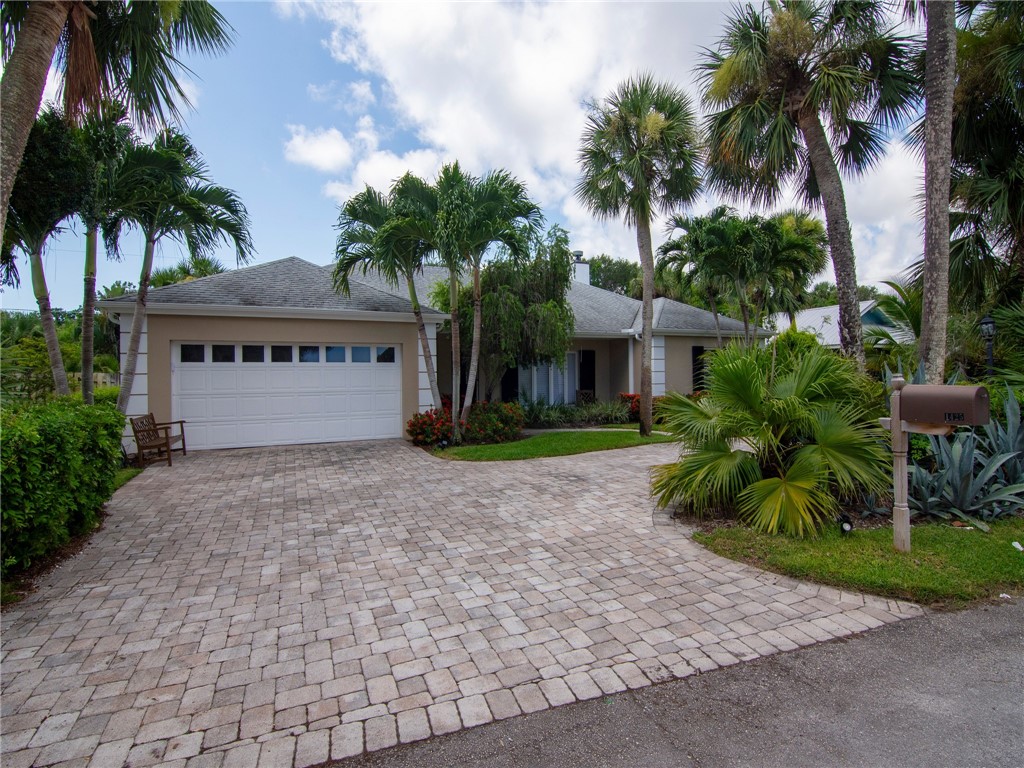 a house with palm tree in front of it