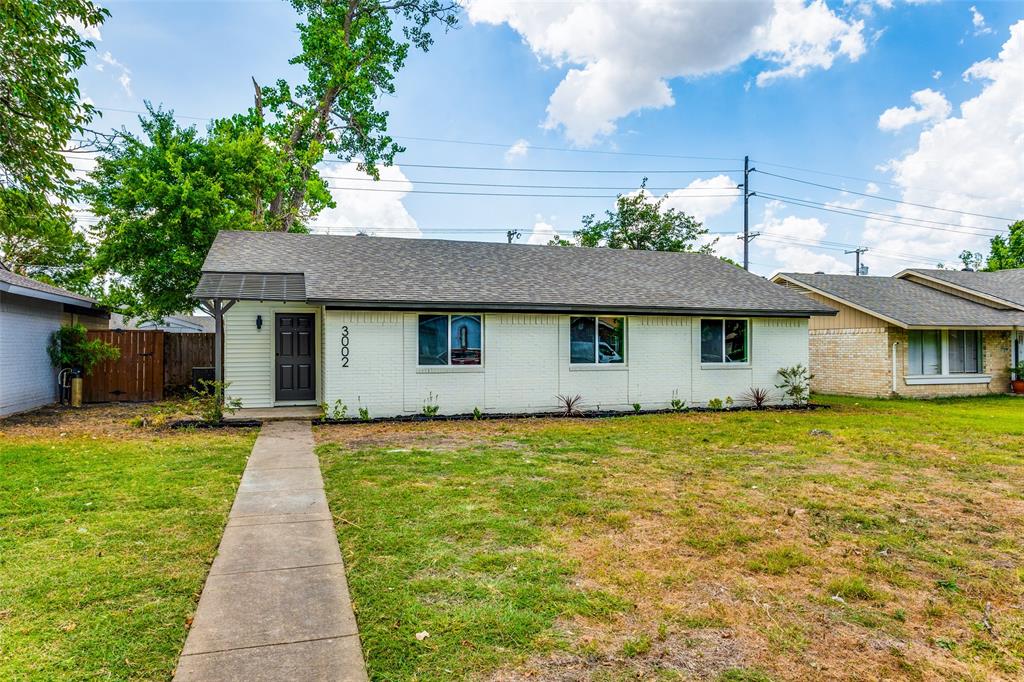 a front view of a house with yard