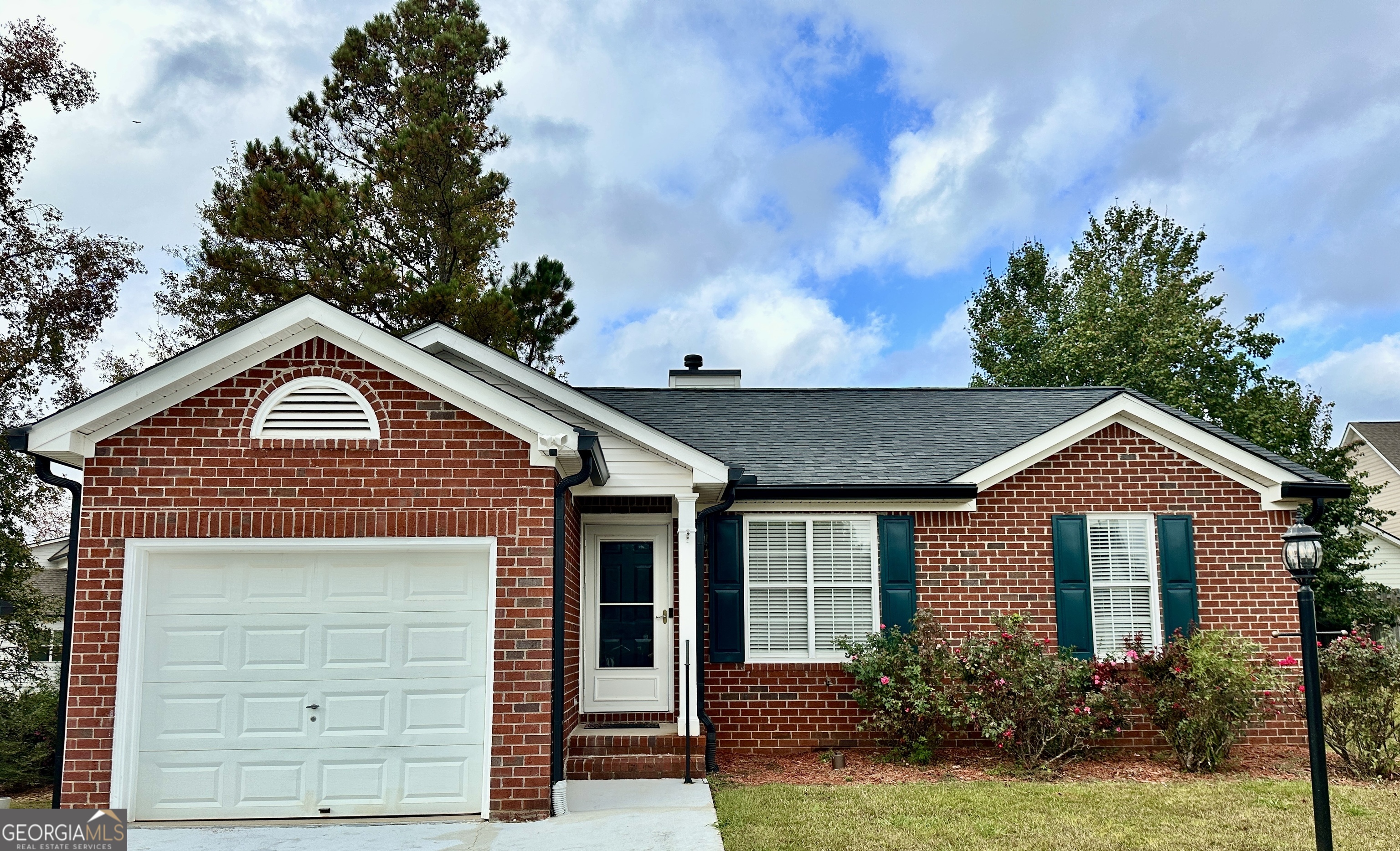 a front view of a house with a yard