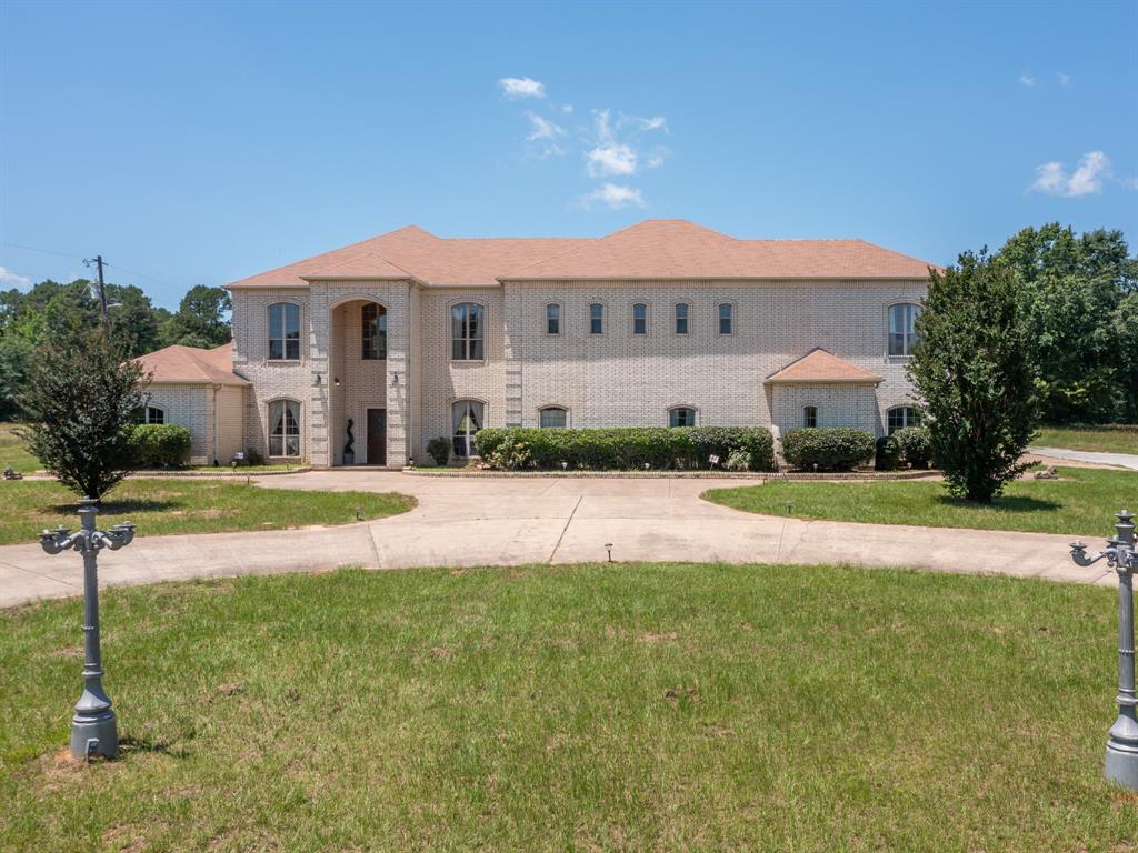 a view of house with a swimming pool