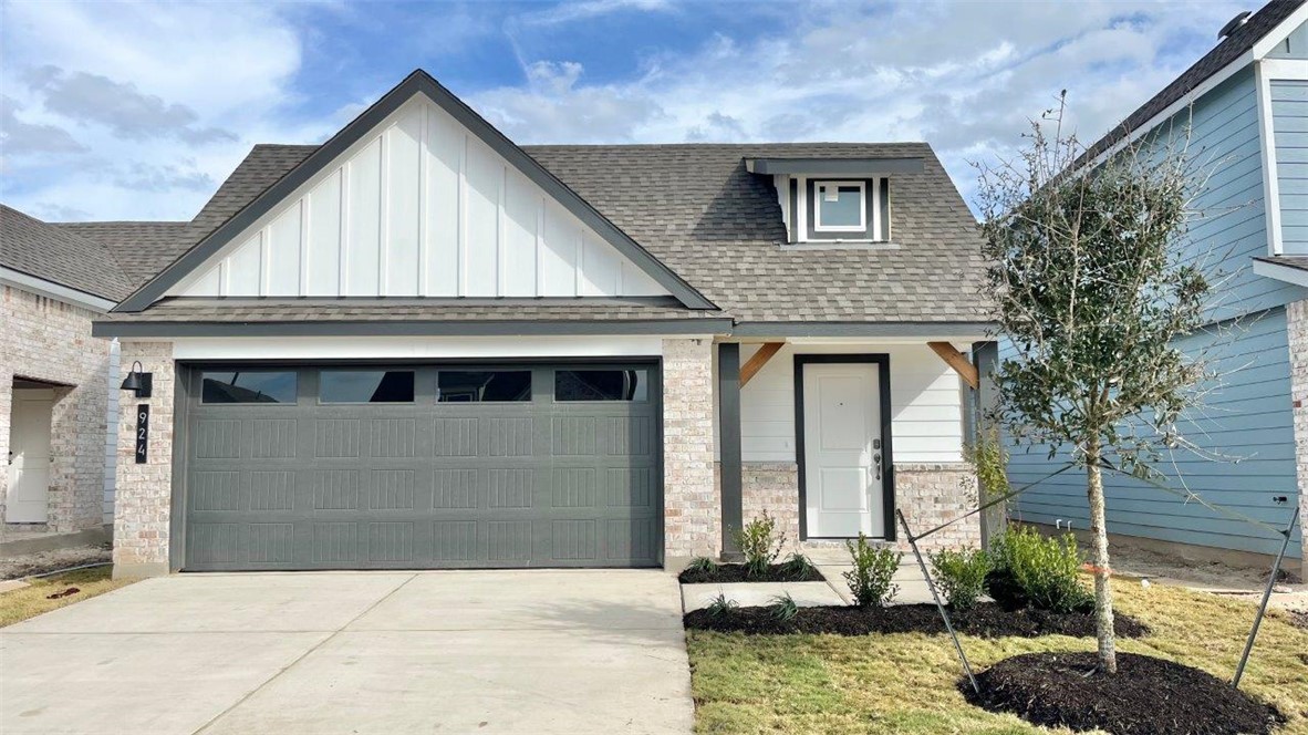 View of front of property featuring a garage