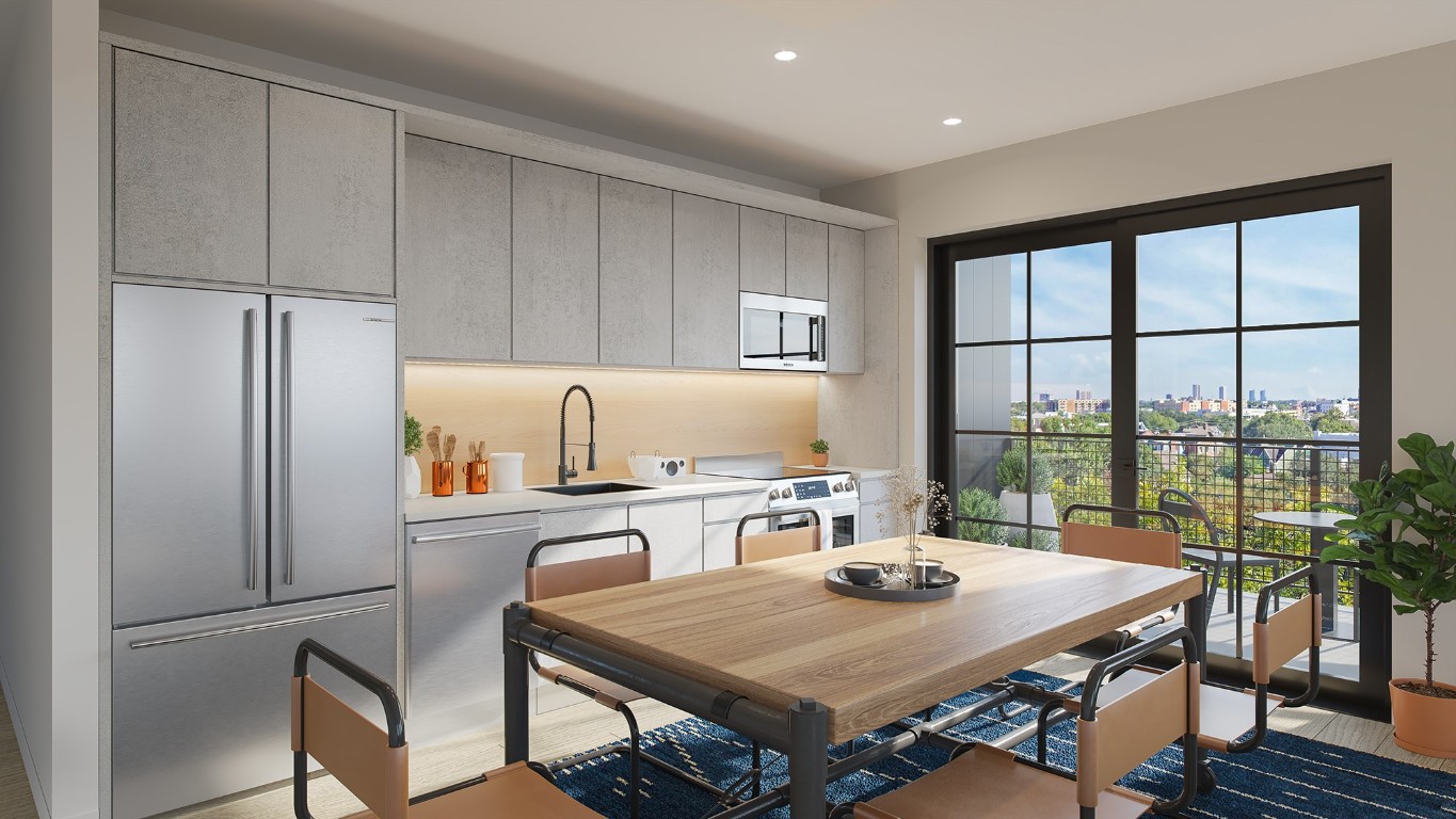 a kitchen with a table chairs and refrigerator