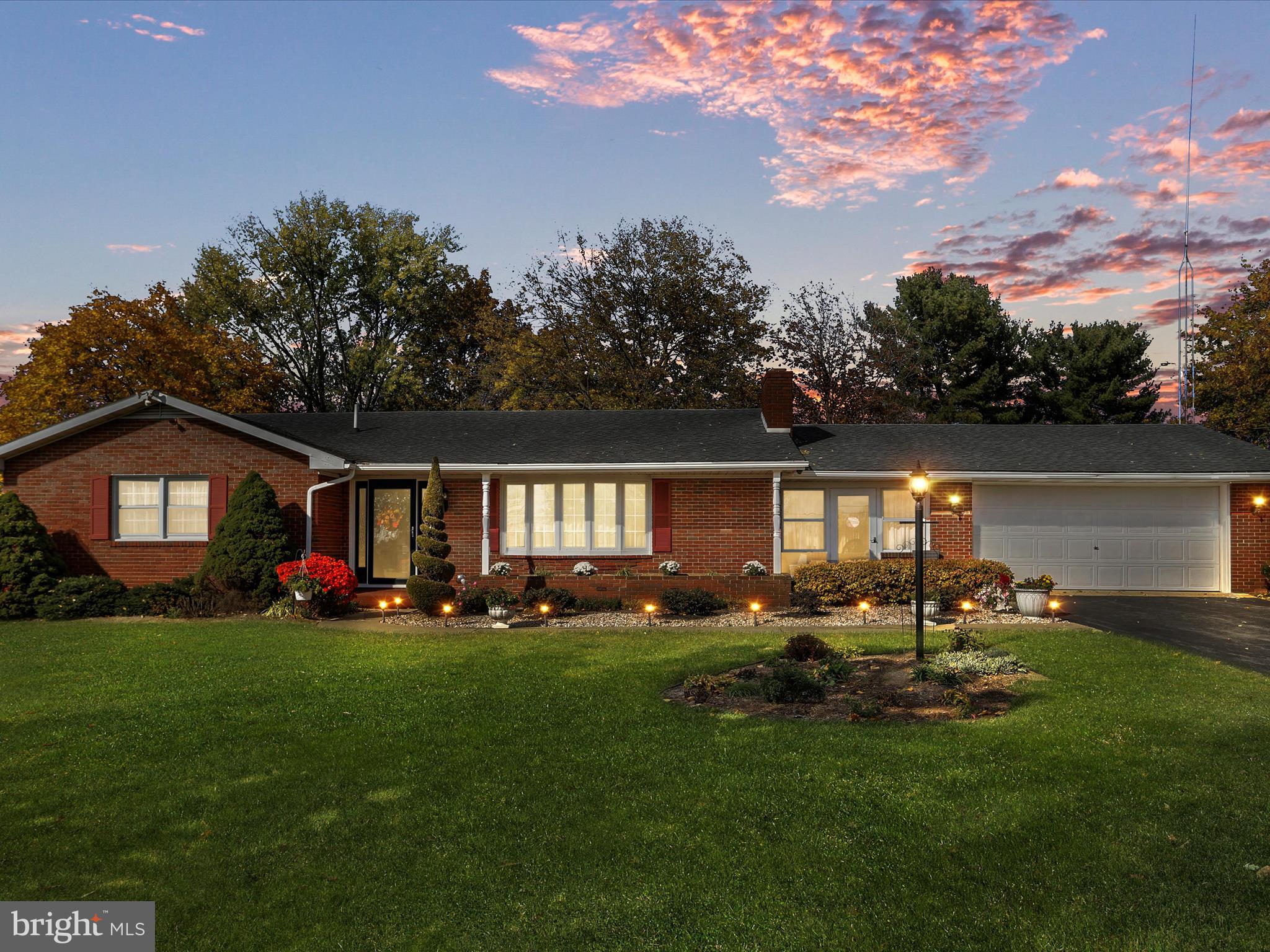 a view of a house with a yard porch and sitting area