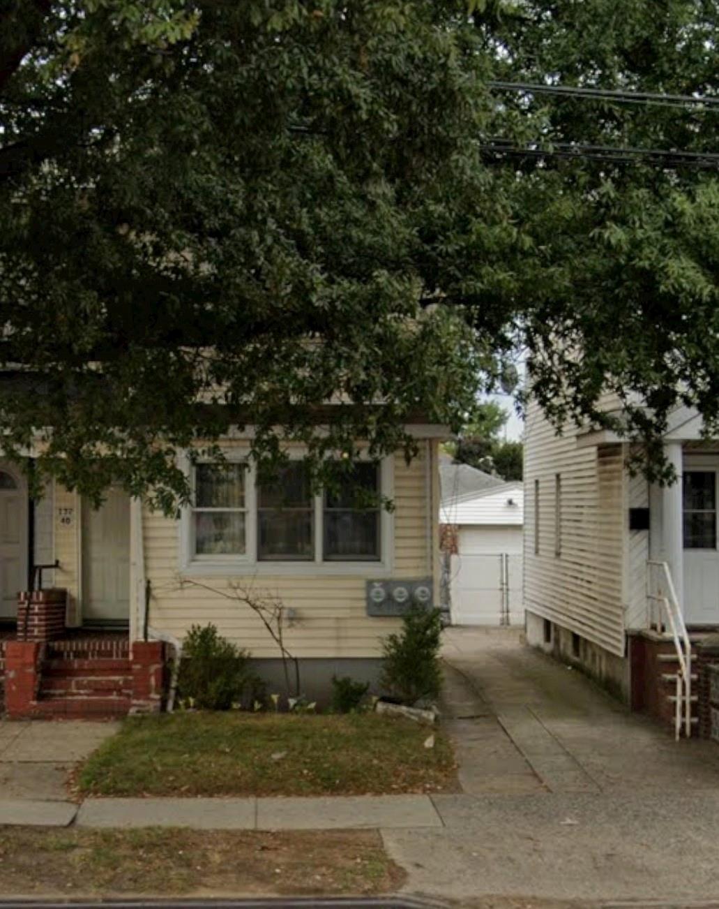 View of front of house featuring shared driveway