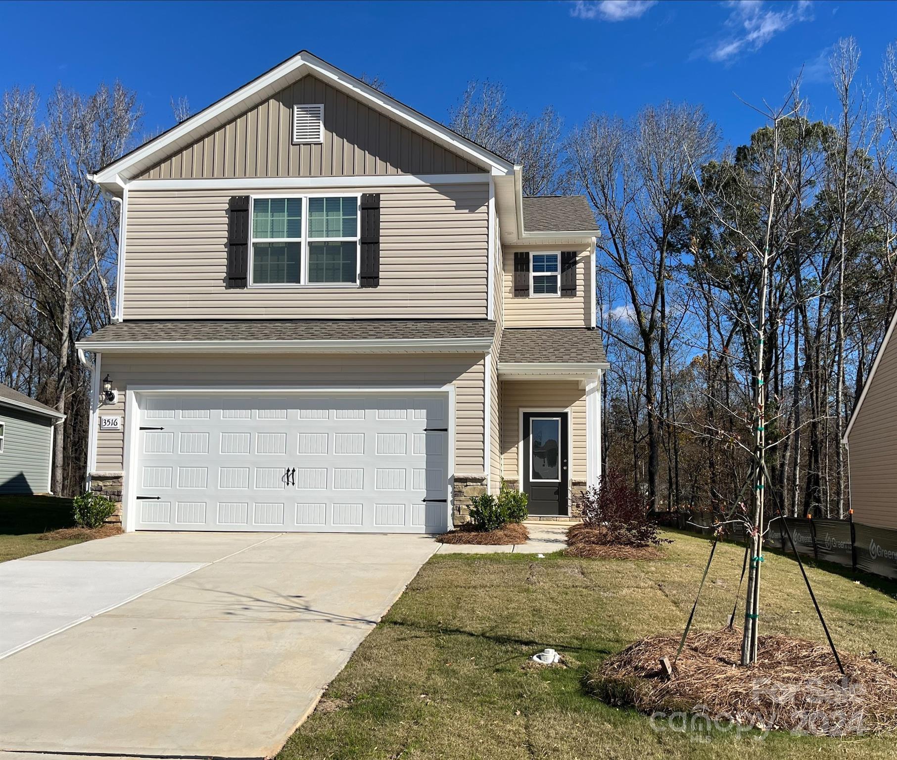 a view of a house with a yard