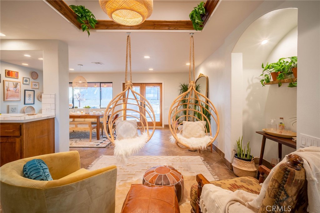 a living room with furniture and a potted plant