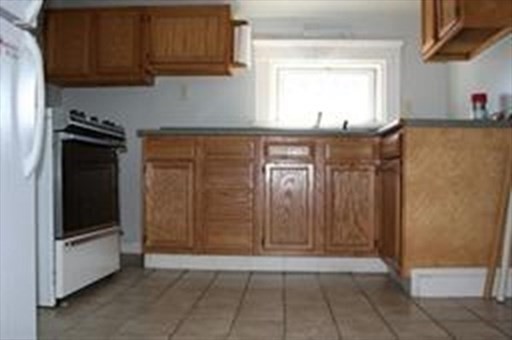 a view of a kitchen from the hallway