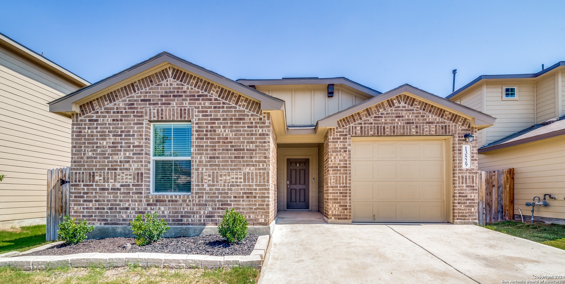 a front view of a house with garage