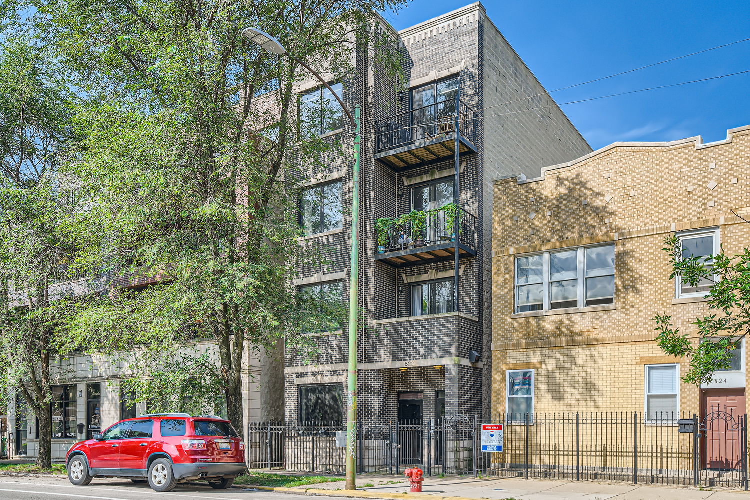 a front view of a building with street view