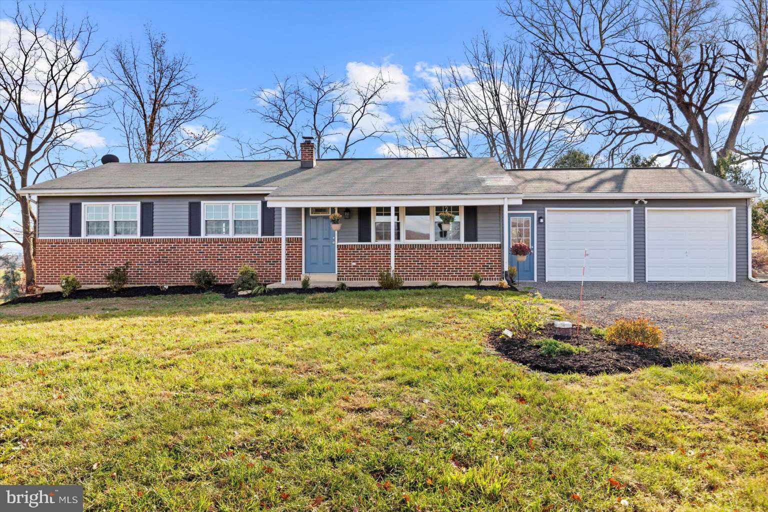 front view of a house with a yard