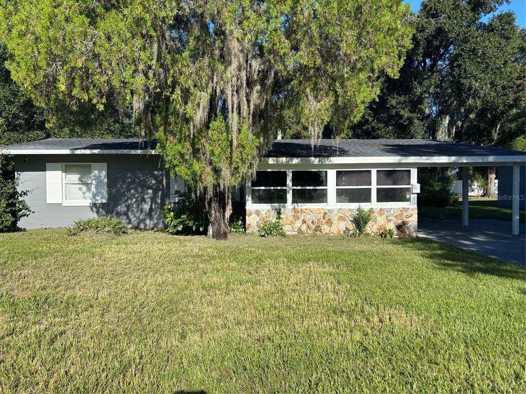 front view of a house with a yard