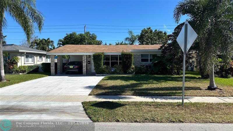 a view of a house with a yard and tree s