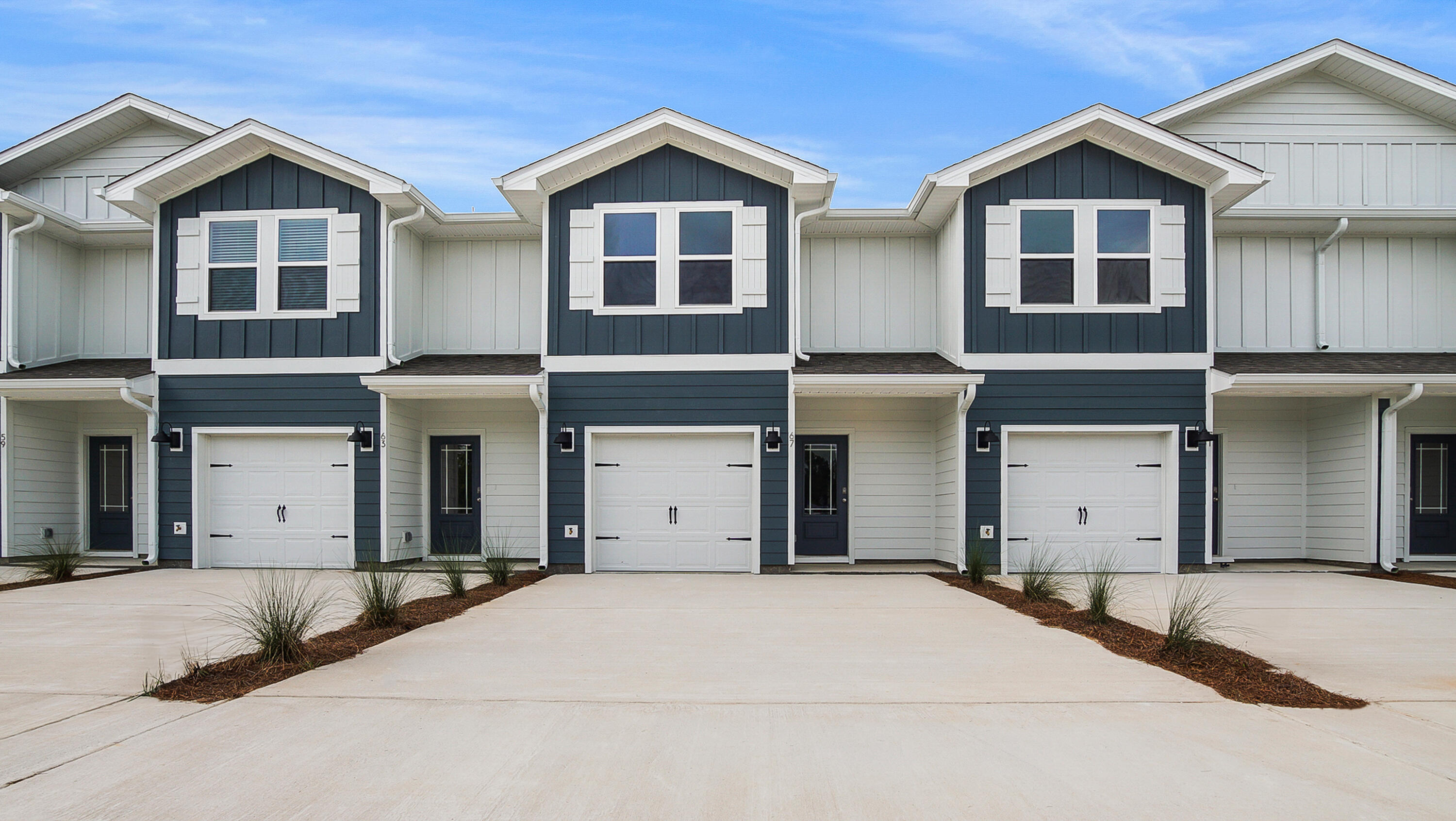 a view of a house with a yard and garage