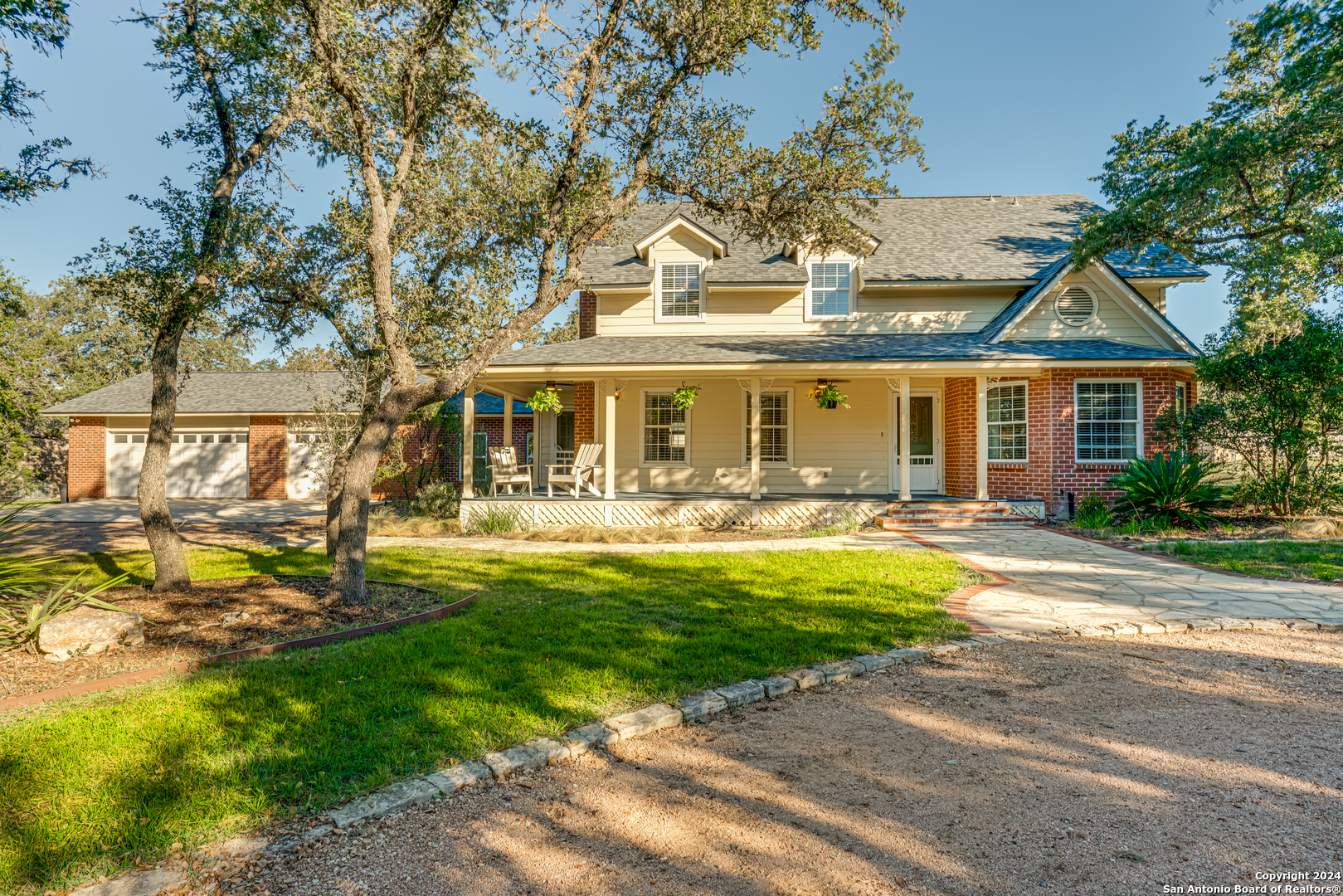 a front view of a house with swimming pool having outdoor seating