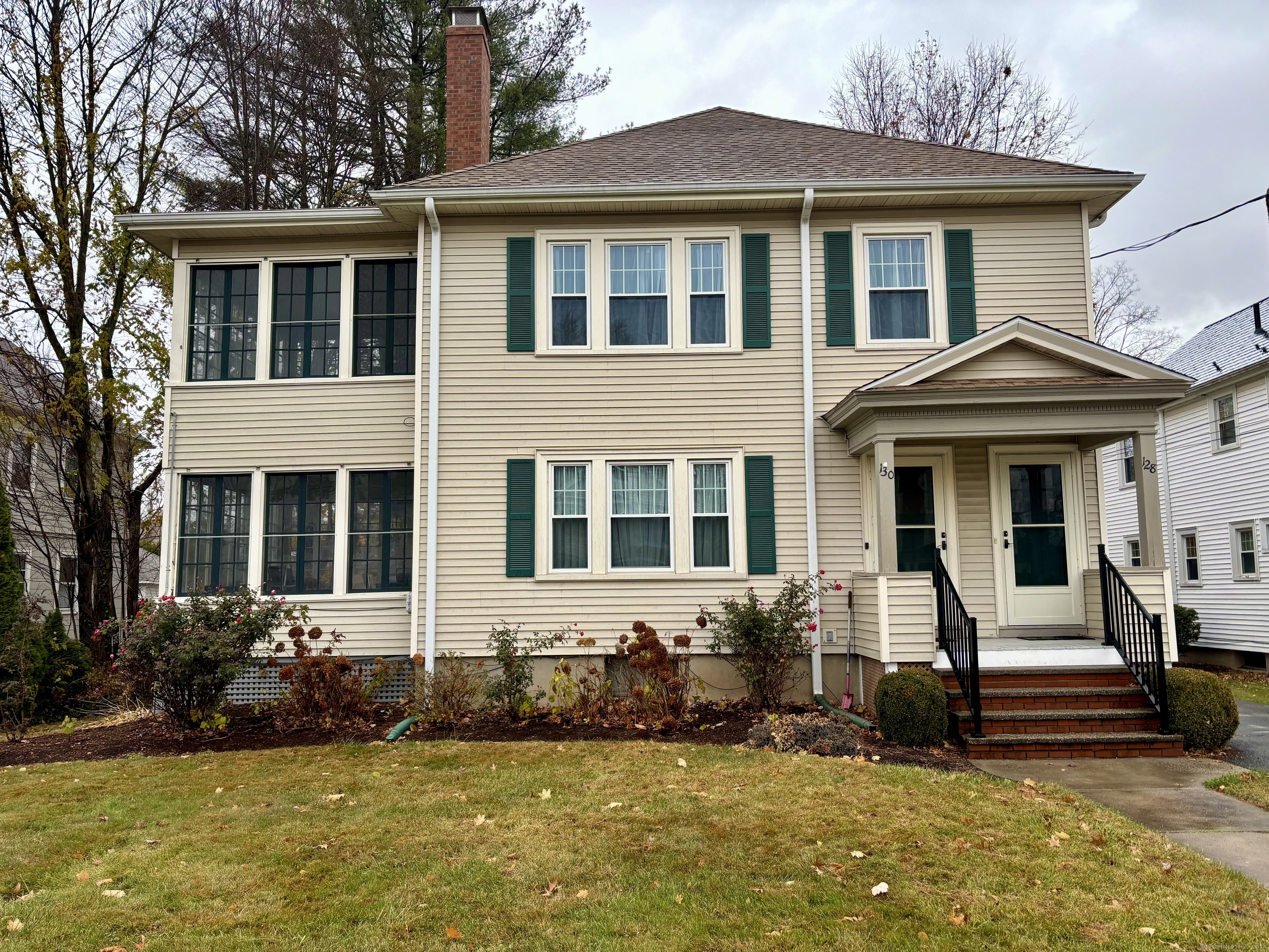 a front view of a house with a yard