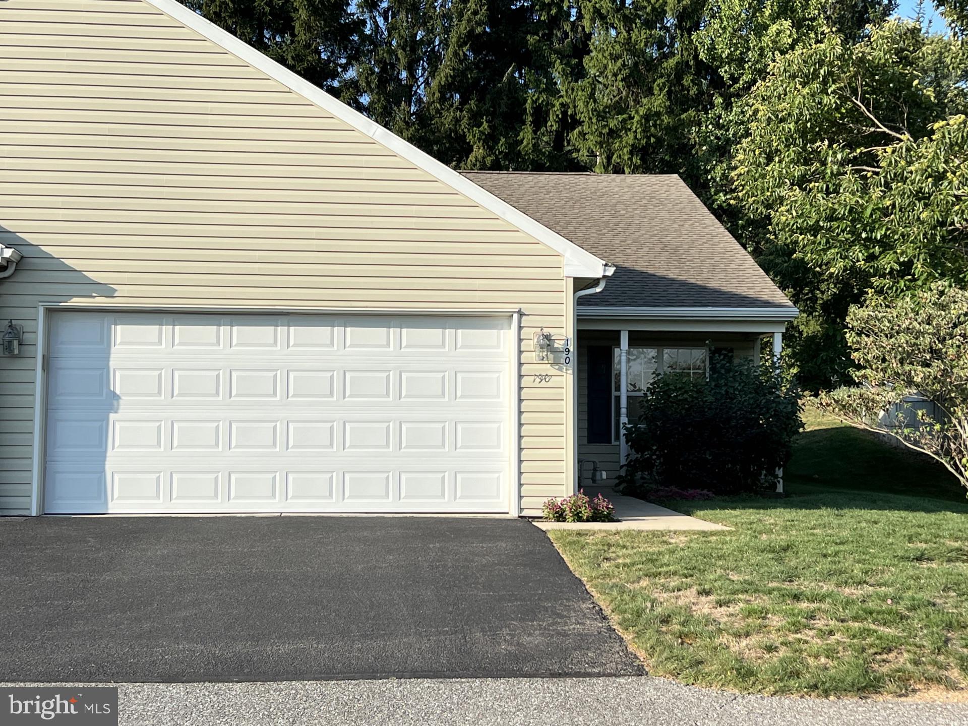 a view of house with backyard