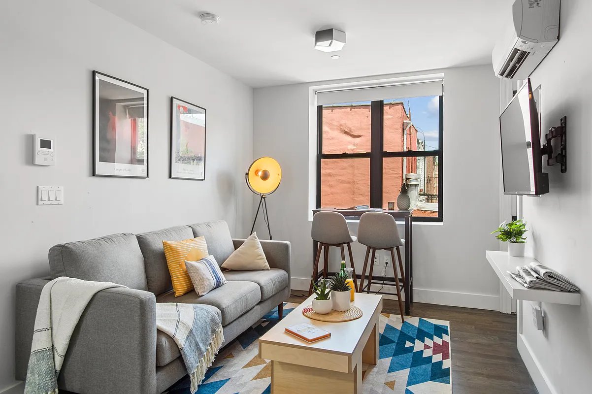 a living room with furniture and a window