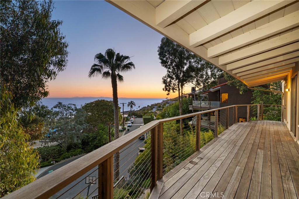 a view of balcony of a house and wooden floor