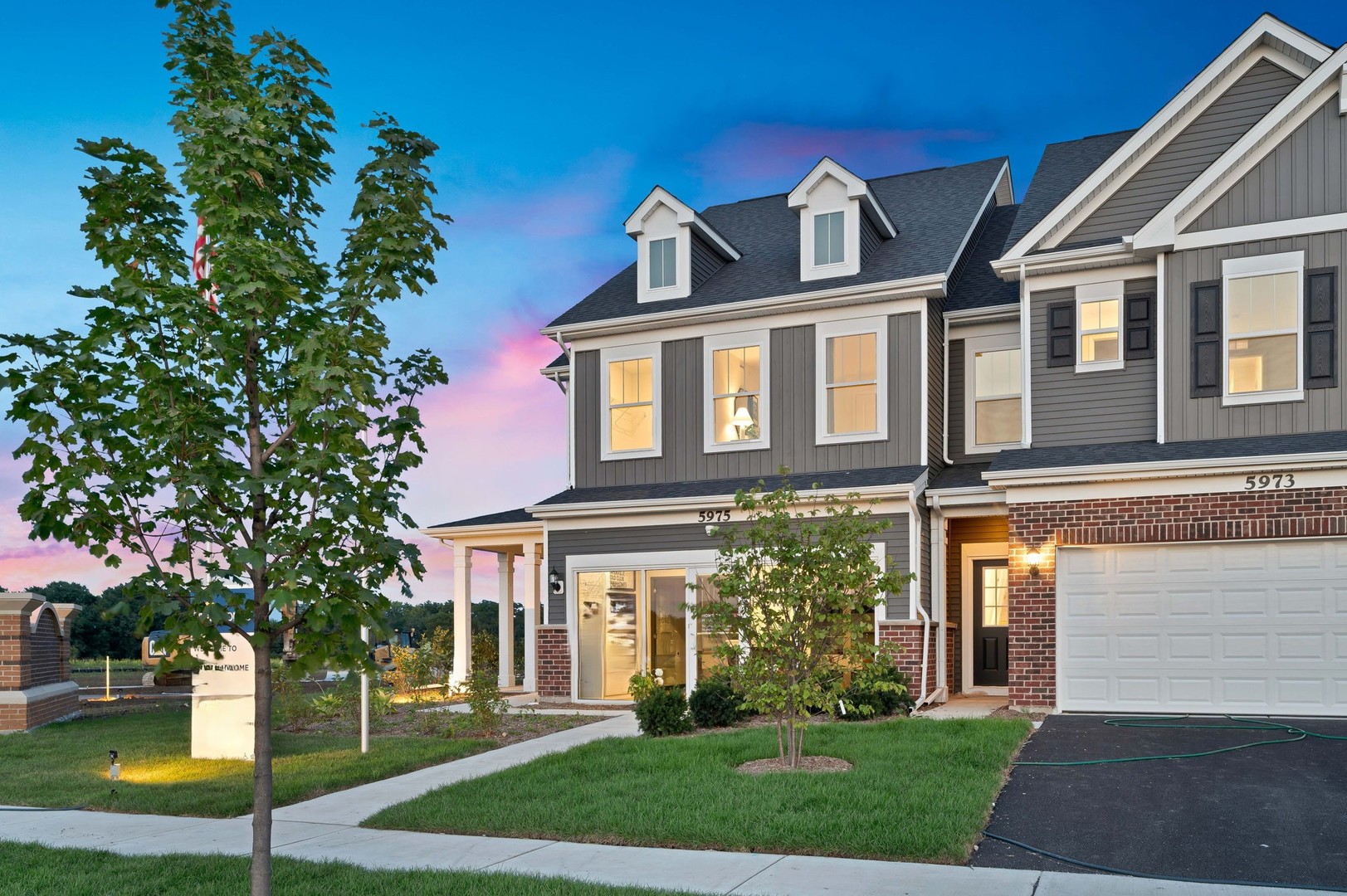 a front view of a house with a yard