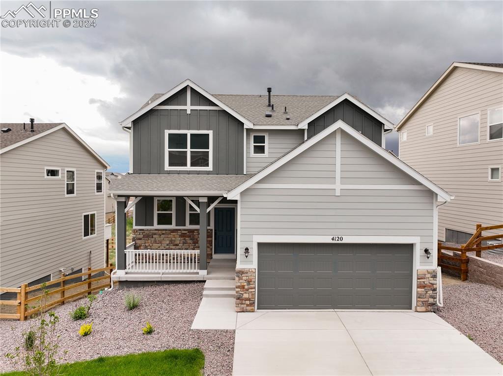 a front view of a house with garage