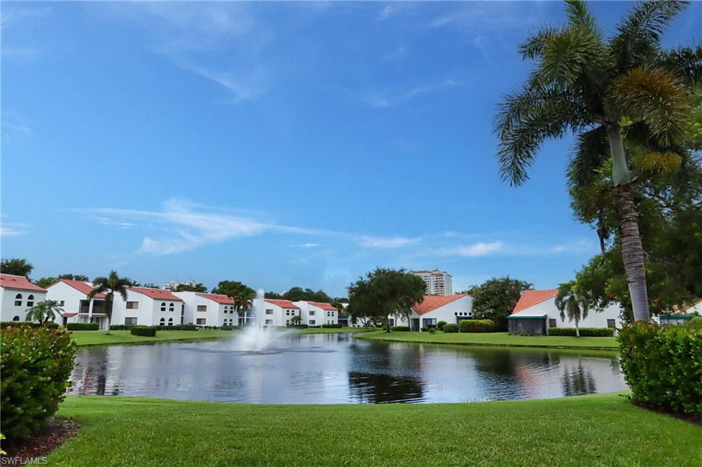 front view of house with yard and lake view