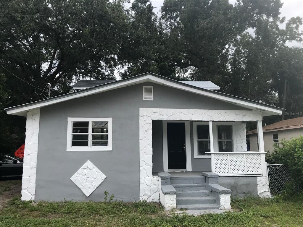 a view of house with yard