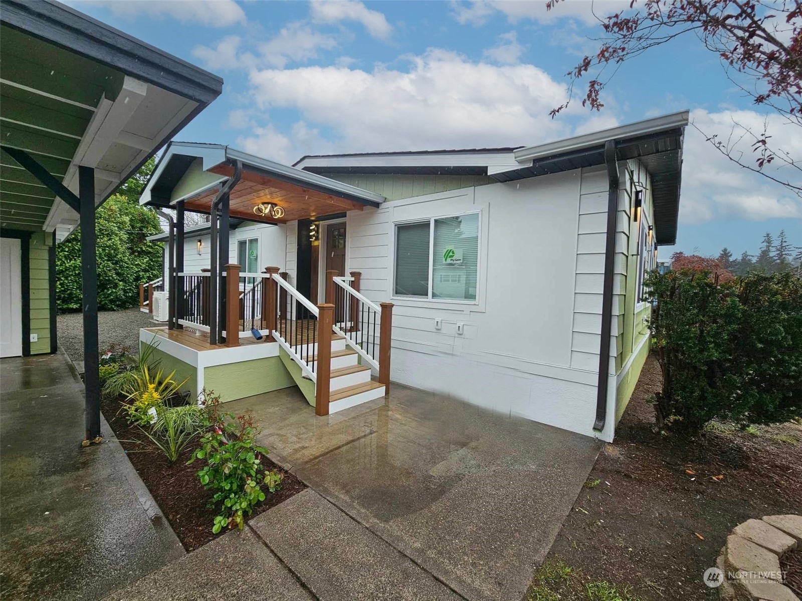 a view of a house with backyard and sitting area