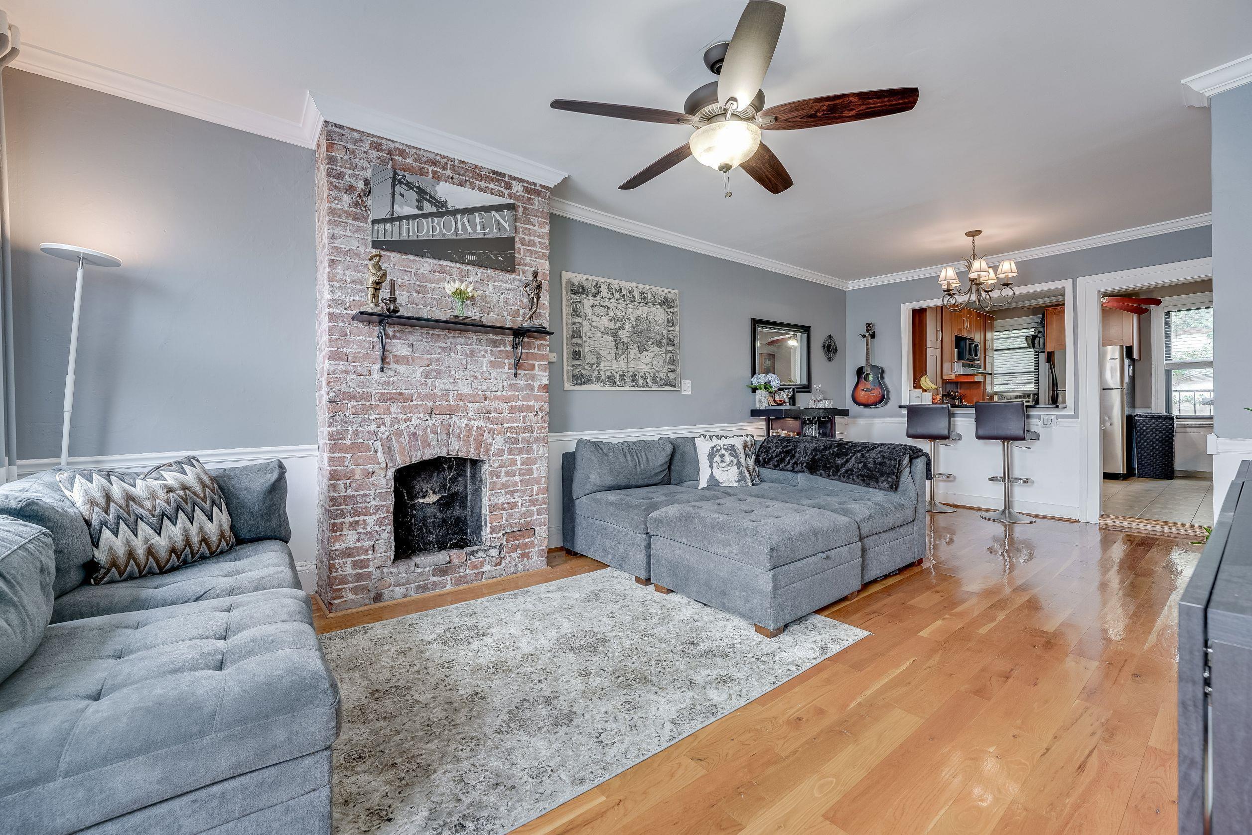 a living room with furniture and a fireplace