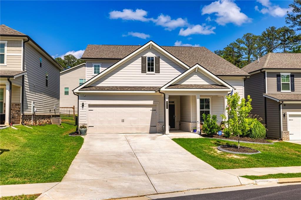 a front view of a house with a yard