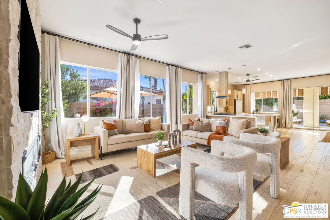 a living room with furniture or outdoor view and a large window