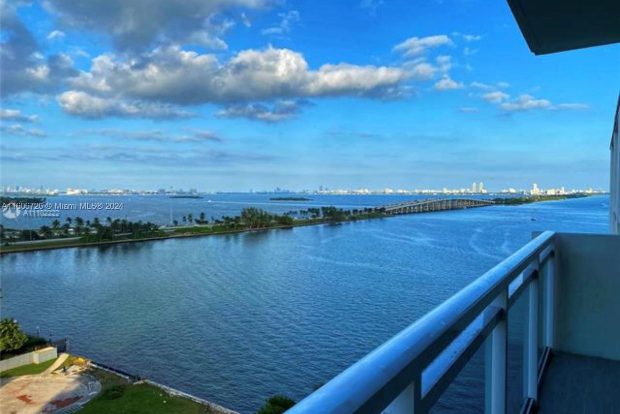 a view of a lake from a balcony