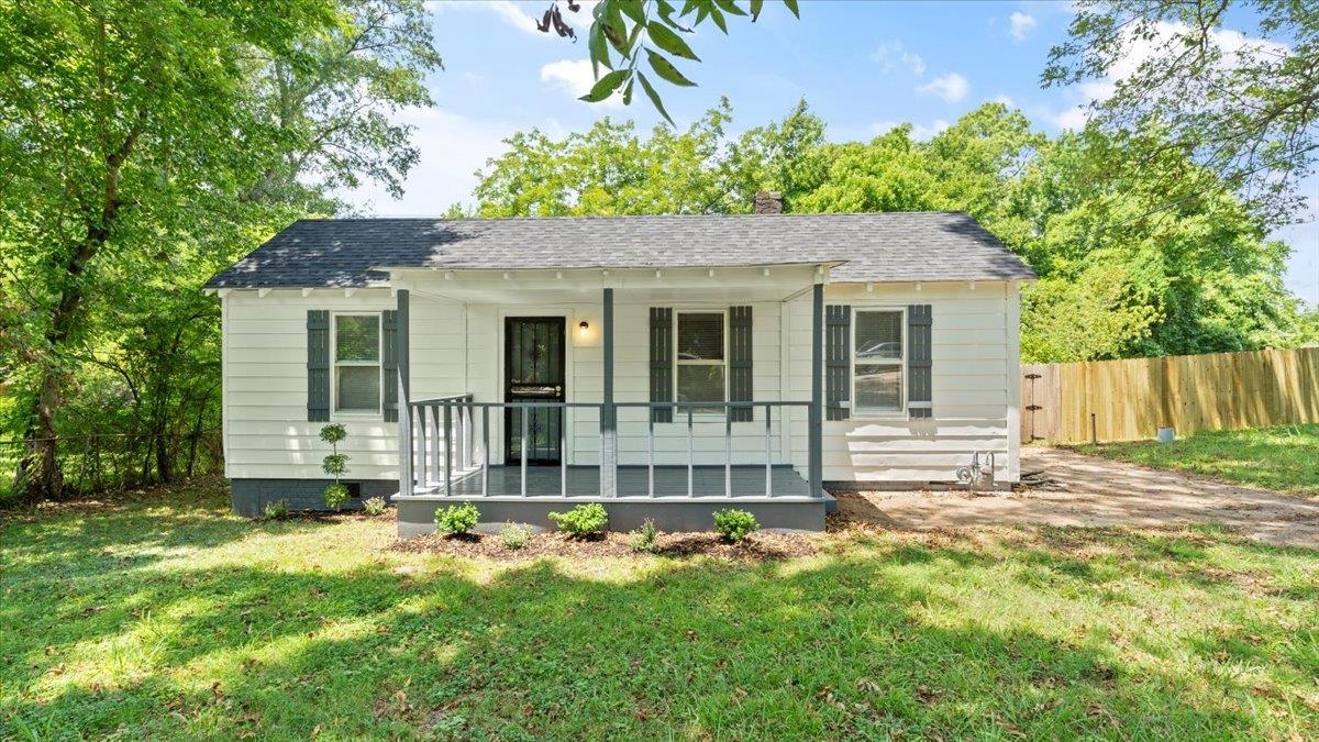 View of front of property with a front yard