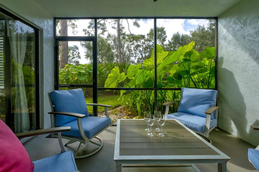 a view of a living room and floor to ceiling window