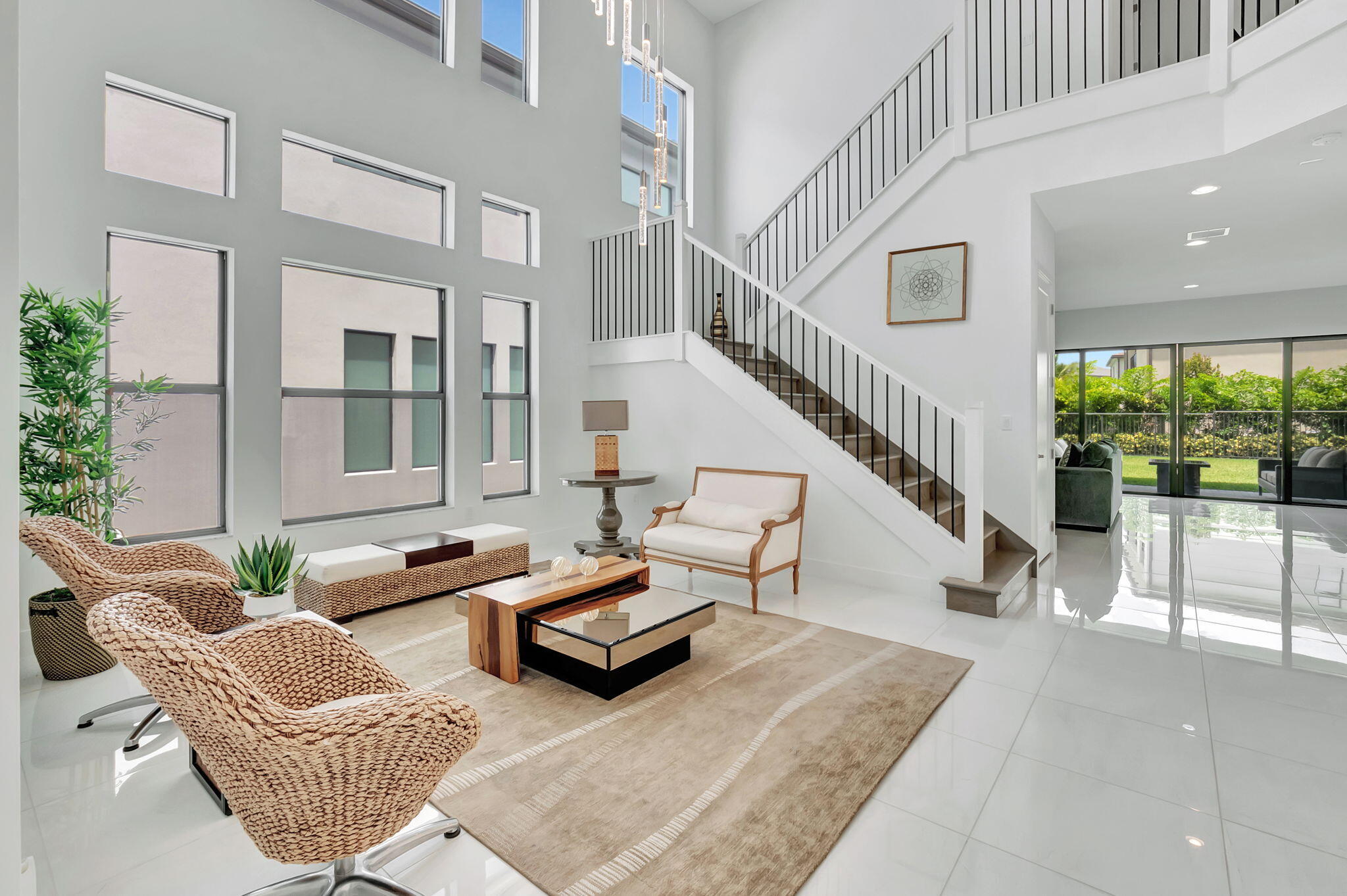 a living room with furniture and a potted plant