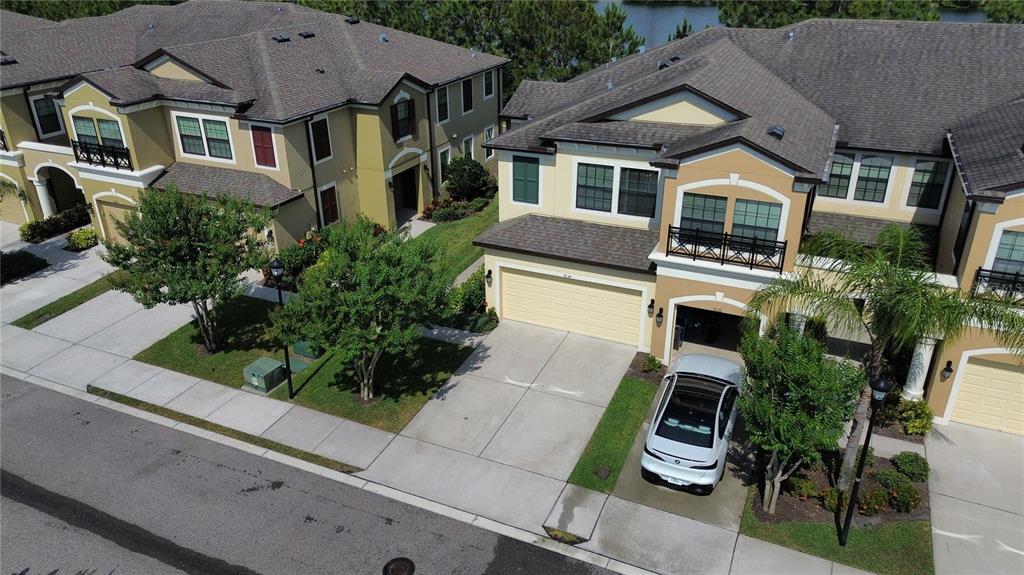 a aerial view of a house with a yard