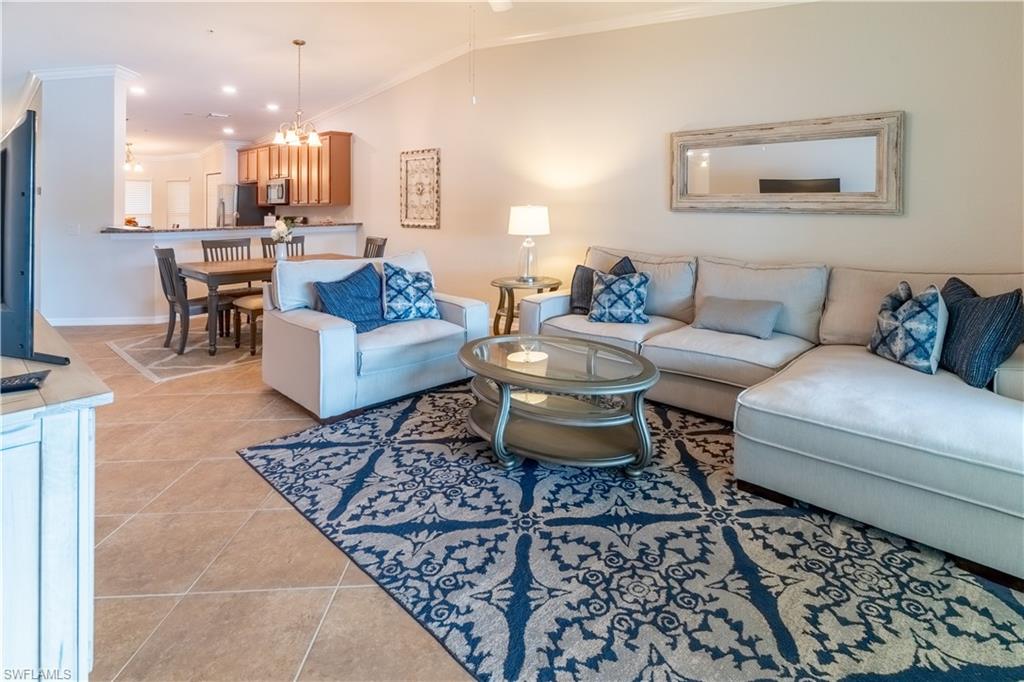 a living room with furniture and a rug