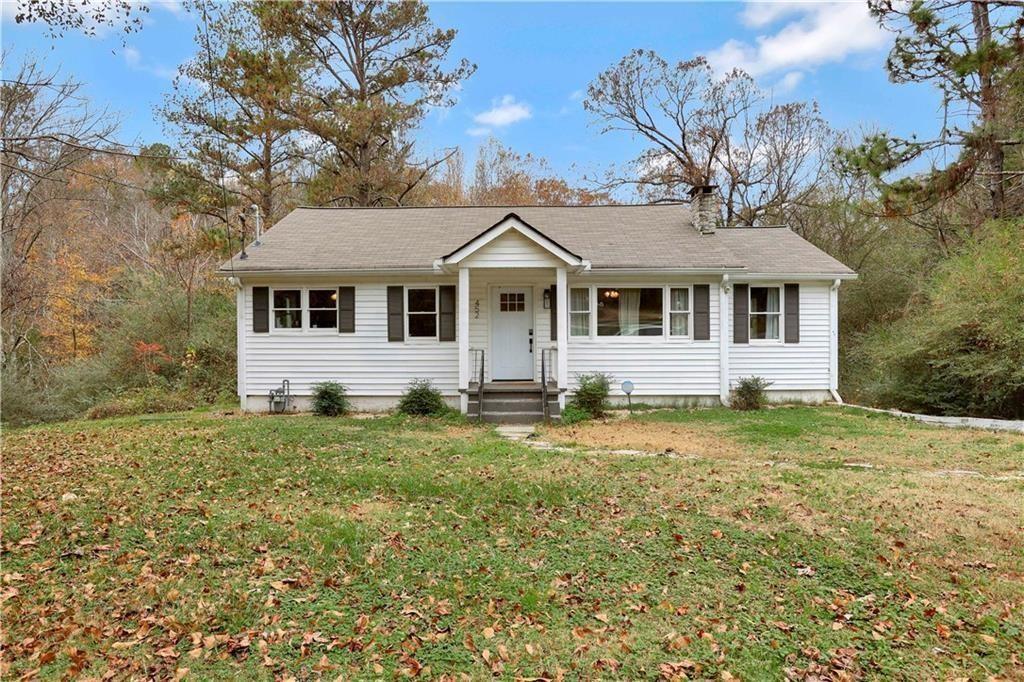 front view of a house with a yard