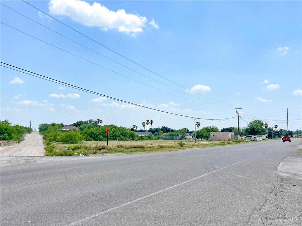 a view of a road and a garden