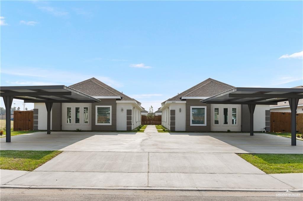 View of front facade with a carport