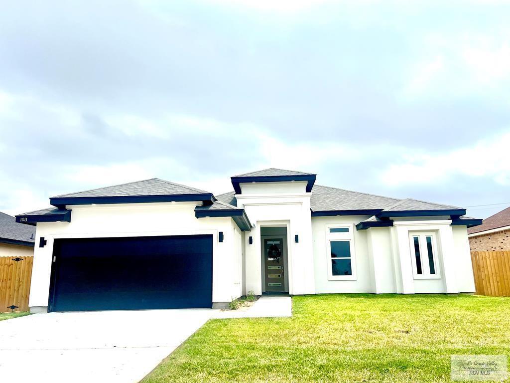 a view of a house with a garage