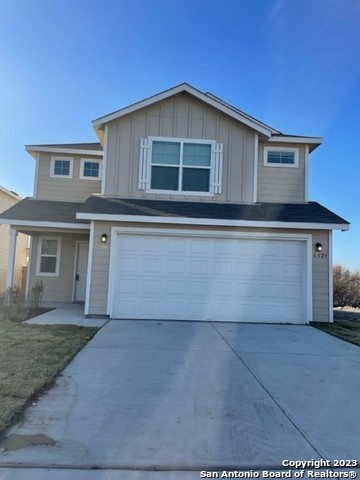 a front view of house with garage