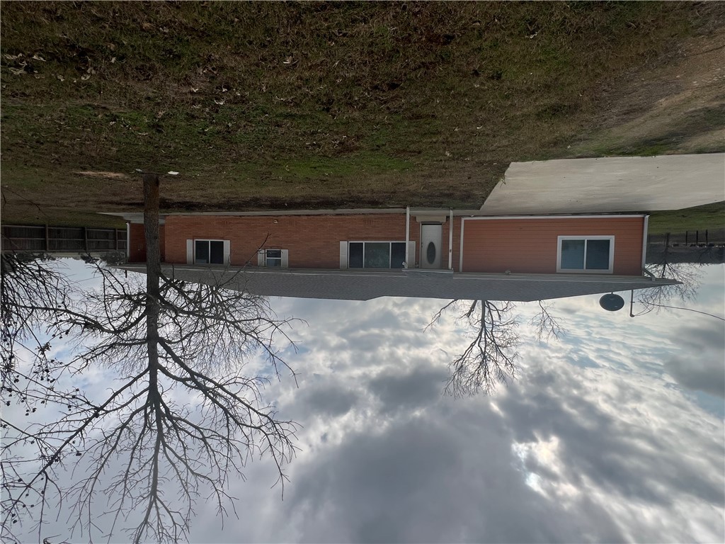 View of front of home featuring a patio and a fron