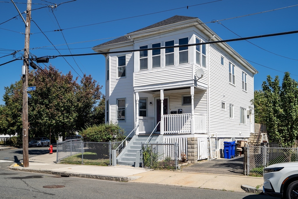 a view of a house with a street